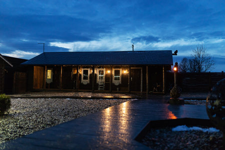 Old wooden house in the village at sunset. Wooden house in the village.