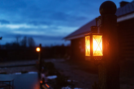 Lantern in the evening on the background of the house.