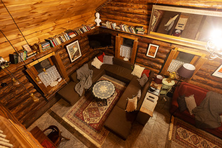 Interior of a cozy living room in a rustic style.