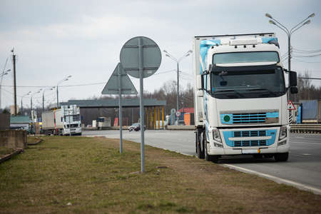 a long traffic jam of many trucks at the border, a long wait for customs checks between States due to the coronavirus epidemic, increased sanitary inspection of cargo transportの写真素材