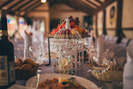 Wedding table with food and wine on the table in the restaurantの写真素材