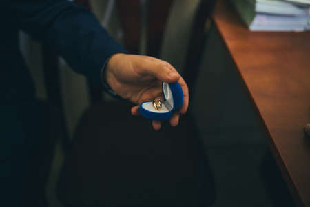 A man holds a ring in his hand. Selective focus.の写真素材