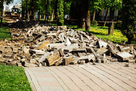 Pile of broken bricks in the city park. Environmental pollution concept.の写真素材