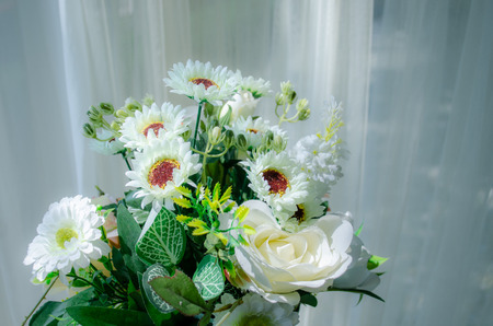 Many white flower bouquets with thin white curtainsの写真素材