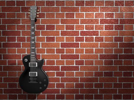 Guitar hanging on a brick wallの写真素材