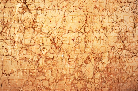 Ancient greek text graved on marble stone slateの写真素材