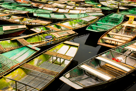 Amazing morning view with Vietnamese boats at river, Tam Coc, Ninh Binh in Vietnam travel landscape and destinationsの写真素材