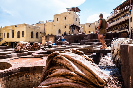 Fez - Morocco - September 29, 2018: Men working in the leather tanneries in Fez, Morocco.のeditorial素材