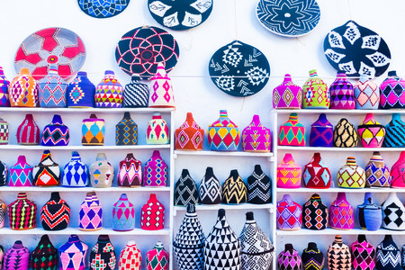 Street souvenyrs market in ancient white medina of the Asilah Village in Moroccoの写真素材