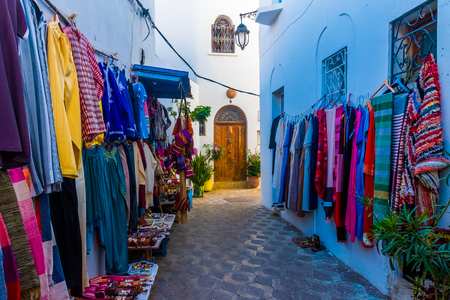 Street souvenyrs market in ancient white medina of the Asilah Village in Moroccoの写真素材
