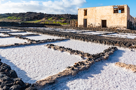 Salt piles on a saline exploration in salt factory refinery mines Janubio, Lanzarote, Canary Islands, Spain.の写真素材