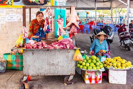 Phu Quoc Island, Vietnam - February 26, 2018: Street woman vendors sell meat on the traditional food marketのeditorial素材