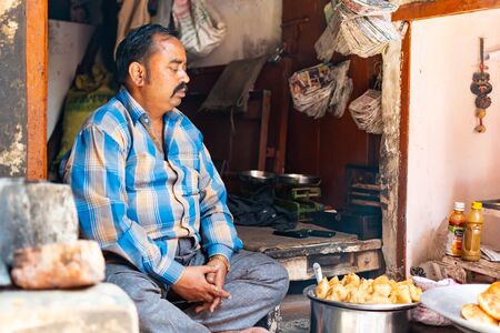 Varanasi, India, Mar 10 2019 - Indian street food vendors cooks traditional and delicious foods for snackのeditorial素材
