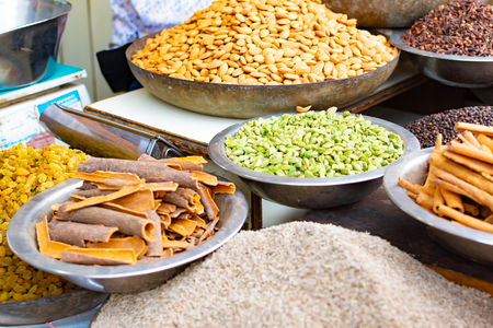 Traditional spices, dry fruits and nuts in local spicy bazaar in New Delhi, Indiaの写真素材