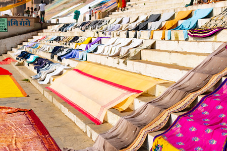 Varanasi, India, Mar 10 2019 - People washing clothes on the ghats of Varanasi near Sacred Ganga Riverの写真素材