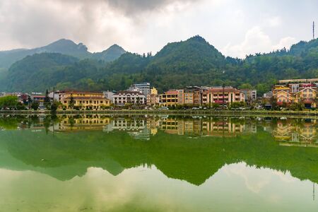 Sapa valley cityscape with reflection on the lake in the morning, Vietnam.の写真素材