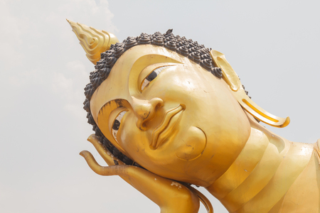 March 23, 2017 : Close up of the face of Reclining Buddha in Wat Kok Mai Daeng, Phitsanulok Province, Thailand.の写真素材