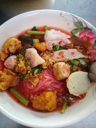 Yentafo Noodles or Cool noodles, Tom Yum and Frame on the table.