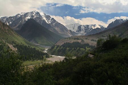 green valley among white mountainsの写真素材