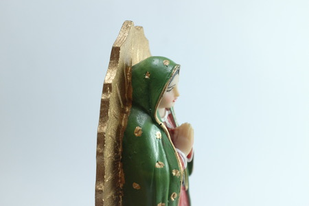 Closed Up Small Figure of Blessed Virgin Mary in Roman Catholic Church on white background.の写真素材
