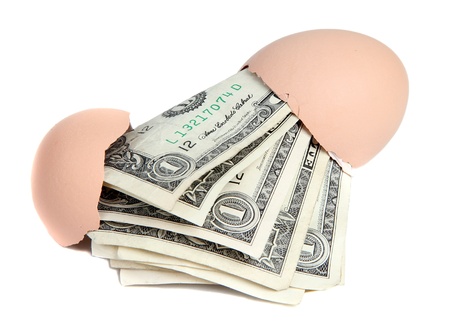 dollar notes in broken eggの写真素材