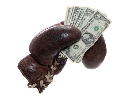old brown boxing glove with dollarsの写真素材