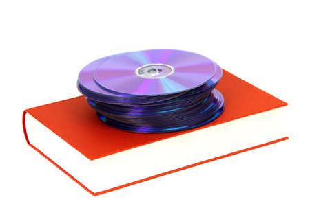 book with DVDs on white