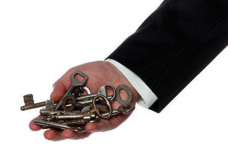 rusty keys on palm of handの写真素材