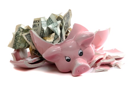 broken piggybank with dollar notes broken piggybank with dollar notes