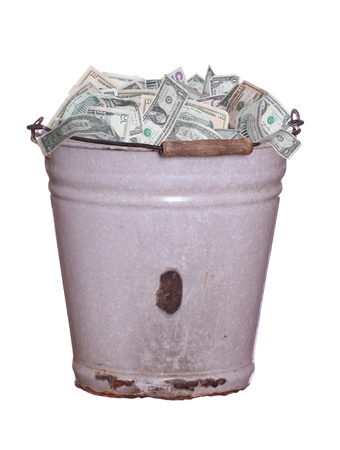 dollars in old rusty bucketの写真素材