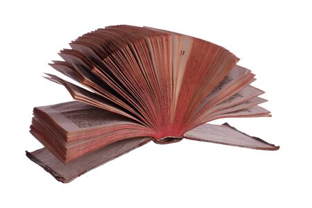 old historic book with fanned pages on whiteの写真素材