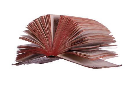 historic book with fanned pages on whiteの写真素材