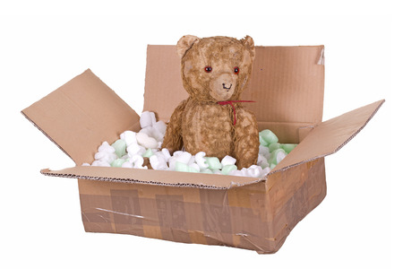 teddy bear in cardboard boxの写真素材