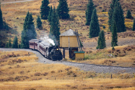 Chama, New Mexico, USA September 28, 2021: Cumbres and Toltec Scenic Railroad getting water from a...