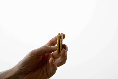 Grabbing a cookie with your handの写真素材