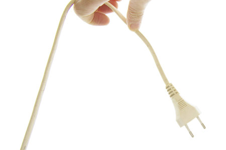 hand of man showing a plug with a white background
