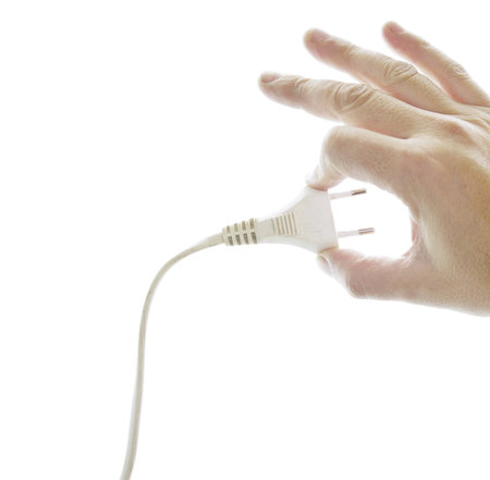 hand of man showing a plug with a white background