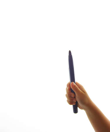 hand of a child with blue retuladorの写真素材