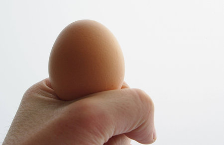 Showing a hand with an egg white