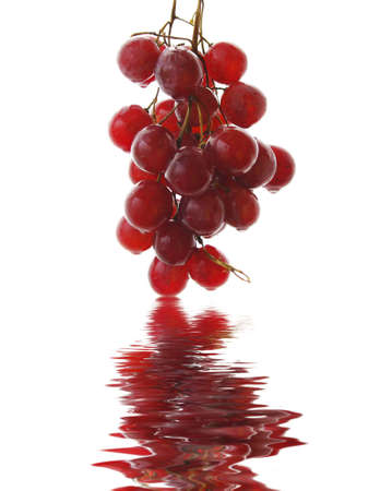 A bunch of red grapes isolated on white backgroundの写真素材