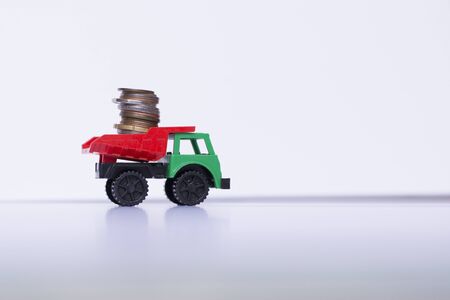 Toy car with coinの写真素材