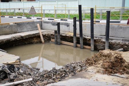 pit with water on the asphalt repair of water supply
