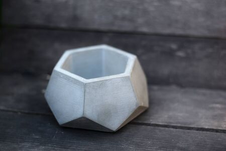 concrete flower pot on wooden backgroundの写真素材