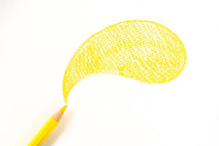 yellow pencil drawing a cloudの写真素材