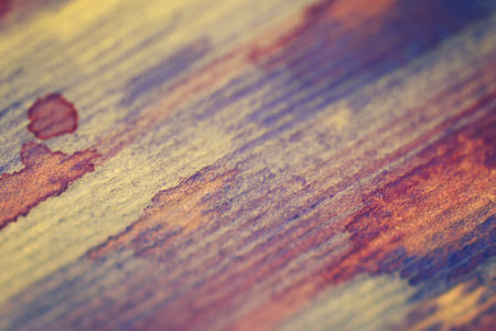Watercolor background on textured paper purple and yellow stripesの写真素材