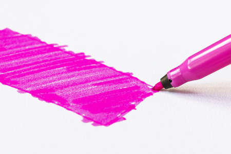 Pink felt tip pen draws a rectangle on paperの写真素材