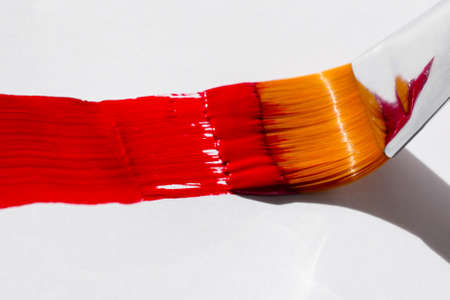 Red smear flat brush acrylic paintの写真素材