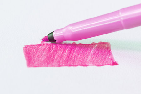 Pink felt tip pen draws a rectangle on paperの写真素材