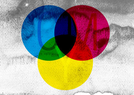 Circles of colors cyan magenta yellow superimposed on each otherの写真素材