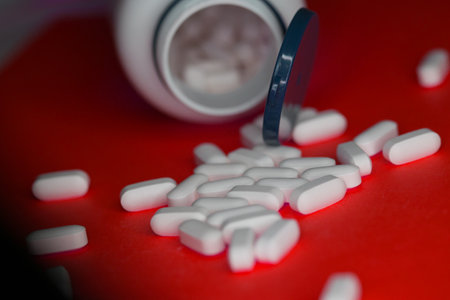 Medcine white pills pharmacy on redの写真素材